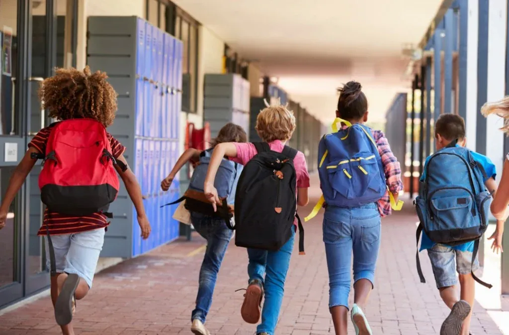 Pupils in a school corridor — school liability illustration for institutions